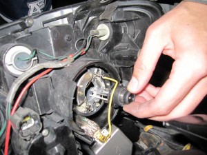 Remove xenon HID bulb from WRX STI headlight assembly carefully